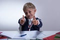 Schoolkid showing thumbs up