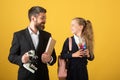 Schoolkid and a teacher on studio background. Portrait of tutor with school girl.