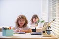 Schoolkids pupils studying homework math during lesson at classroom, education concept, Cute schooler. First graders. Royalty Free Stock Photo