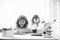 Schoolkids pupils studying homework math during lesson at classroom, education concept, Cute schooler. First graders. Royalty Free Stock Photo