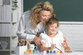 Schoolkids with teacher. Teacher and little students portrait, teachers day. Happy children from elementary school study Royalty Free Stock Photo