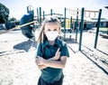 Schools closures Coronavirus lockdown. Bored school kid alone in playground feeling sad and lonely Royalty Free Stock Photo