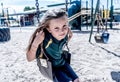 Schools closures Coronavirus lockdown. Bored school kid alone in playground feeling sad and lonely Royalty Free Stock Photo