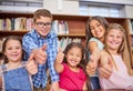 Schools cool. Portrait of a group of young children showing thumbs up at school. Royalty Free Stock Photo