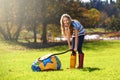 Schools out and summer is here. Portrait of a teenage girl inflating an inflatable ball outdoors. Royalty Free Stock Photo