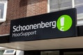 Schoonenberg logo sign above the entrance of the shop.