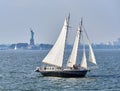 Schooner Apollonia sails in NY Harbor with the Statue of Liberty in the background