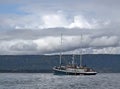 Schooner rigged motor sailer in the bay Royalty Free Stock Photo