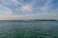 Schooner Sailing Past Small Island