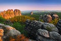 Schrammsteine, beautiful evening view over sandstone cliff into deep misty valley in Saxony Switzerland, evening background, the