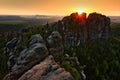 Schrammsteine, beautiful evening view over sandstone cliff into deep misty valley in Saxony Switzerland, foggy background, the fog Royalty Free Stock Photo