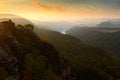 Schrammsteine, beautiful evening view over sandstone cliff into deep misty valley in Saxony Switzerland, foggy background, the fog Royalty Free Stock Photo