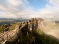 The Schramsteine and Falkenstein rocks in early autumnal view. Rocks in the Elbe Sandstone Mountains park