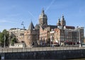 The Schreierstoren with spires and bell tower of the Basilica of Saint Nicholas in the background, Amsterdam, The Netherlands Royalty Free Stock Photo