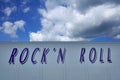 Lettering Rockn Roll with dramatic sky as background