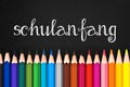 Schulanfang (meaning Back to school) written on black chalkboard background Royalty Free Stock Photo