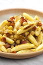 schupfnudel with bacon, onion and chick peas Royalty Free Stock Photo