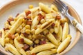 schupfnudel with bacon, onion and chick peas Royalty Free Stock Photo