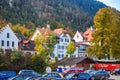 SCHWANGAU, GERMANY - OKTOBER 09, 2018: Beautiful houses with mountains in the background in autumn