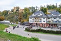 SCHWANGAU, GERMANY - OKTOBER 09, 2018: View of Hohenschwangau castle and beautiful old building with tourists in Alps Royalty Free Stock Photo