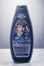 Schwarzkopf shampoo isolated on gradient background.