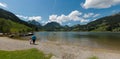Schwarzsee, FR / Switzerland - 1 June 2019: tourists enjoy the summer lakeside view at the Schwarzsee Lake in the Swiss Alps in
