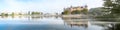 Schwerin panorama of the castle, bridge and town with reflection in the lake and morning fog, copy space Royalty Free Stock Photo