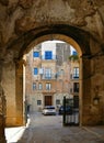 Sciacca, Agrigento, Sicily, Italy 26.08.2018. Cityscape with old historical buildings, courtyard with medieval arch.