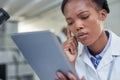 Science is all about problem solving. a young scientist using a digital tablet in a lab. Royalty Free Stock Photo