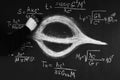 Science and black holes.Basic properties of black holes. A scientist writes physical and mathematical formulas on a blackboard