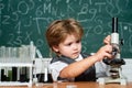 The Science Classroom. Little kid scientist earning chemistry in school lab. Biology lesson. Kid is learning in class on Royalty Free Stock Photo