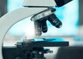 Science, closeup and a microscope for research of bacteria, studying medicine or dna in a lab. Healthcare, gear or