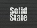 Science concept: Solid State on wall background Royalty Free Stock Photo