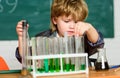 Science concept. Wunderkind experimenting with chemistry. Boy test tubes colorful liquids chemistry school classroom Royalty Free Stock Photo