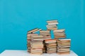 science education stack of books on a blue background teaching literacy Royalty Free Stock Photo