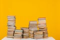 science education stack of books on a yellow background teaching literacy Royalty Free Stock Photo
