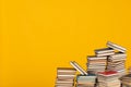 science education stack of books on a yellow background teaching literacy