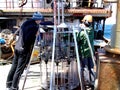 The Sea of Okhotsk / Russia - July 10 2015: Science expedition team on the stern of RV Akademik Lavrentyev reparing the multicore