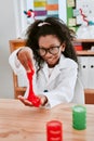 Science, experiment and African child with slime learning, studying or happy experience in school. Scientist, girl in