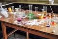 science experiment gone wrong, with beakers and test tubes strewn across the bench top Royalty Free Stock Photo