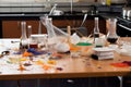 science experiment gone wrong, with beakers and test tubes strewn across the bench top Royalty Free Stock Photo