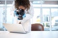 Science investigation, camera and black woman with laptop in laboratory for forensic research with evidence. Photography