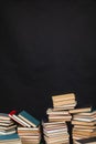 science knowledge reading many books in stacks in the library on a black background Royalty Free Stock Photo