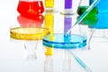 Science Laboratory glassware pipette drop, reflective white back Royalty Free Stock Photo