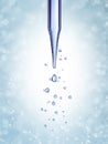 Science laboratory pipette with a drop of chemical Royalty Free Stock Photo