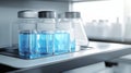 Science Laboratory Research Blue Reagent Filled Vials and Flasks Inside a Modern Lab Equipment Royalty Free Stock Photo