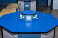 Science laboratory table of gas nozzles and electricity on a blue empty school lab table in an educational setting for Royalty Free Stock Photo