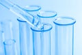Science laboratory test blue tubes, macro flask equipment. Chemical dropper