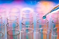 Science laboratory test tubes with chemical formula on screen , Royalty Free Stock Photo