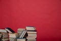science learning library stack of books on red background